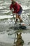 Tabbing piers on mudflat used for fishing