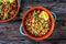 Tabbouleh salad - bulgur groats, tomatoes, cucumber, parsley, lemon, onion and fresh mint leaves on wooden background