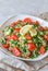 Tabbouleh Tabouli salad on light gray concrete background