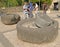 TABGHA, ISRAEL. Ancient millstones on the territory of the Church of the Multiplication of Bread and Fish