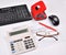 Table accounting: invoice, keyboard, calculator, mouse, hole punch, glasses and red pen