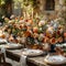 Table adorned with beautiful flowers in vases, plates, candles, and drinkware