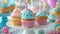 A table adorned with cupcakes, candles, and colorful decorations for a sweet birthday celebration