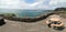 Table and bench and promenade with stone wall