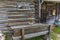 Table and benches in front of an old traditional wood chalet on the alpine meadows in Switzerland during spring