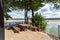 Table and benches for relaxing by the lake near a wooden country house