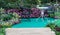 Table and chair in hedge of garden