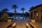 Table and chair in poolside patio of luxury villa