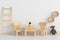 Table and chair in white child room for mockup, 3D rendering