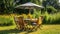 Table, chairs and umbrella outdoors in garden. Summer spring picnic concept