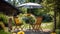 Table, chairs and umbrella outdoors in garden. Summer spring picnic concept