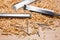 Table with chisel blades and shavings of wood sawdust and nails work of an artisan carpenter.