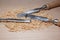 Table with chisel blades and shavings of wood sawdust work of an artisan carpenter