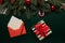 On the table decorated with Christmas decor lies a letter with wishes for Santa Claus