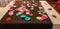 table decorated with coloured circles made of papier mache