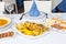 table decorated with various traditional Canarian foods: fish soup, gofio, and other delicacies