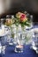 Table decoration with roses and glasses for an informal festive