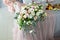 Table decorations made of bouquets of flowers in a vase during catering at a wedding or events