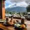 A table with elegantly arranged dishes against a background of mountain ranges visible outside the window