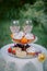 Table with festive treat and tablecloth in the summer garden