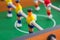 Table football game with yellow and red players and white goalkeeper. Table soccer game.