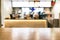 Table foreground with blurred fast food counter background