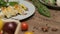 Table with fresh vegetables, spices and chicken roll with spinach