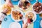 Table full of food at lunch - marine fish and healthy food - above and top view - some hands taking food from the middle of the