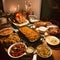 A table full of food for Thanksgiving candles and a roast turkey. Turkey as the main dish of thanksgiving for the harvest
