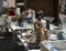 Table full of marvelous ceramic silverware and a statue of an Asian female