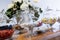 Table with glass jars with assortment of colored sugared almonds