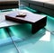 Table on green lighted floor