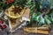 On the table laid Christmas decorations. Cake, cinnamon, star anise, pieces of dried lemons, pine branch.