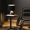 Table lamp with book on coffee table near stylish metal armchair at night, luxury dark gray interior scene close up, fancy hotel