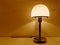 Table lamp giving warm orange light