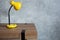 table lamp at wooden table near concrete grey wall