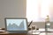 Table with laptop prepared for business meeting in conference hall