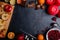 On the table the layout of cranberries, oranges, apples, and candles. Place for the inscription. View from above.