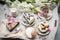 Table with loads of coffee, cakes, cupcakes, desserts, fruits, flowers and croissants.