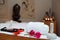 Table with massage accessories and crystal and butterfly decorations