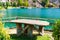 Table for picnic, lake and green trees landscape