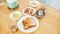 A table with a plate of breakfast food and coffee, toast, sausage and corn chowder