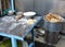 Table for preparing chapati at streetside restaurant in Delhi, I