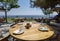 Table of restaurant by the sea under the shadow of green trees greece preveza perfecture