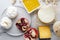 Table served with gouda,provolone,ricotta,buratta,peanuts,pomegranates,honey for tasty dinner.Top view of served table,plenty of g