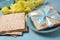 Table served for Passover Pesach indoors, with matzah bread