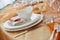 Table set in orange organza for a wedding banquet