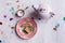 Table set with pretty craft paper background, tea pot and cup combo for one, antique plate with biscuits and tiny sugar bowl