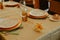 Table set in a restaurant with plates, silverware, wine glasses and napkins