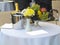 Table set for romantic dinner with champagne flowers and fruits